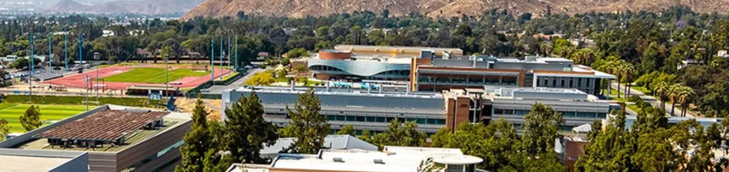 Aerial image of UCR Campus and mountains behind it